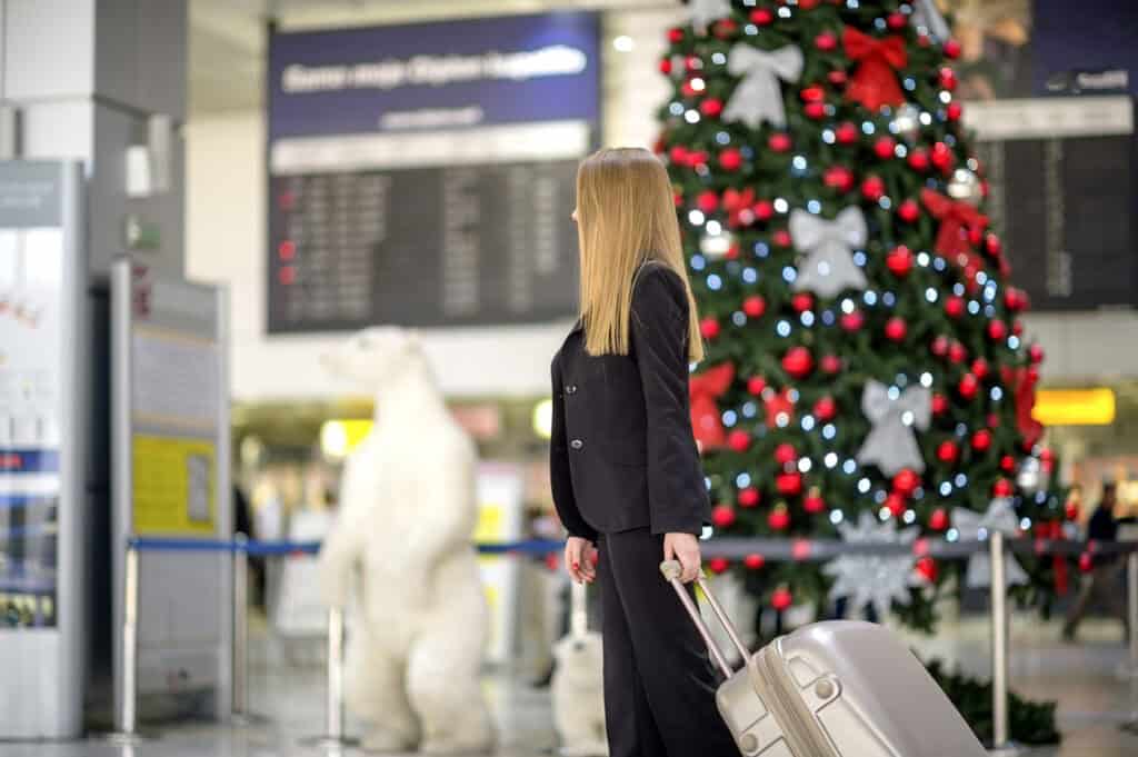 Young woman walks in airport terminal